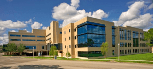 A large building with many windows on the side of it.