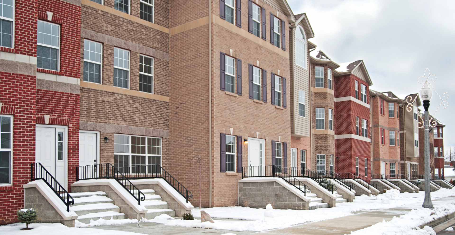 row of townhouse rental properties representing renters insurance coverage